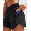 imageCRZ YOGA Dolphin Athletic Shorts for Women 5  Mid Waisted Quick Dry for Running Workout Gym Track with Zip PocketBlack