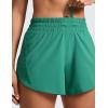 imageCRZ YOGA Dolphin Athletic Shorts for Women 5  Mid Waisted Quick Dry for Running Workout Gym Track with Zip PocketCascadia Green