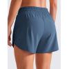 imageCRZ YOGA Dolphin Athletic Shorts for Women 5  Mid Waisted Quick Dry for Running Workout Gym Track with Zip PocketStelindigo Blue