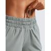 imageCRZ YOGA Dolphin Athletic Shorts for Women 5  Mid Waisted Quick Dry for Running Workout Gym Track with Zip PocketSterling