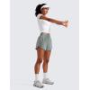 imageCRZ YOGA Dolphin Athletic Shorts for Women 5  Mid Waisted Quick Dry for Running Workout Gym Track with Zip PocketSterling