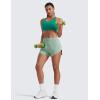 imageCRZ YOGA Dolphin Flat Waist Athletic Shorts for Women 3  High Rise Quick Dry for Running Workout Gym Track with Zip PocketsGreen Palm Court