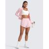 imageCRZ YOGA Dolphin Flat Waist Athletic Shorts for Women 3  High Rise Quick Dry for Running Workout Gym Track with Zip PocketsStrawberry Pink