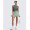 imageCRZ YOGA Drapey 2 in 1 Athletic Shorts for Women  High Waisted V Slit Casual Tennis Running with PocketsGreen Palm Court