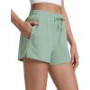 imageCRZ YOGA Drapey 2 in 1 Athletic Shorts for Women  High Waisted V Slit Casual Tennis Running with PocketsGreen Palm Court