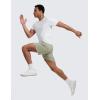imageCRZ YOGA Mens Linerless Split Training Shorts 7  Lightweight Quick Dry Soft Workout Running Athletic Gym with PocketsFog Green
