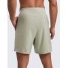 imageCRZ YOGA Mens Linerless Split Training Shorts 7  Lightweight Quick Dry Soft Workout Running Athletic Gym with PocketsFog Green