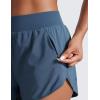 imageCRZ YOGA Dolphin Flat Waist Athletic Shorts for Women 3  High Rise Quick Dry for Running Workout Gym Track with Zip PocketsStelindigo
