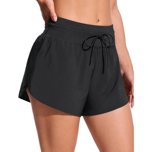 image:imageCRZ YOGA Split Dolphin Board Shorts for Women  High Waisted Overlay Swim Skorts Bathing Suit Bottoms with Brief LinerBlack