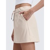 image:imageCRZ YOGA 4Way Stretch A Line Skirts for Women  High Waitsted Mini Lined Tennis Work Drawstring Skort with PocketsMojave Tan