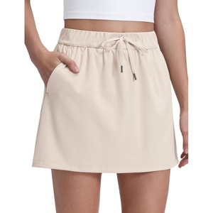 image:imageCRZ YOGA 4Way Stretch A Line Skirts for Women  High Waitsted Mini Lined Tennis Work Drawstring Skort with PocketsMojave Tan